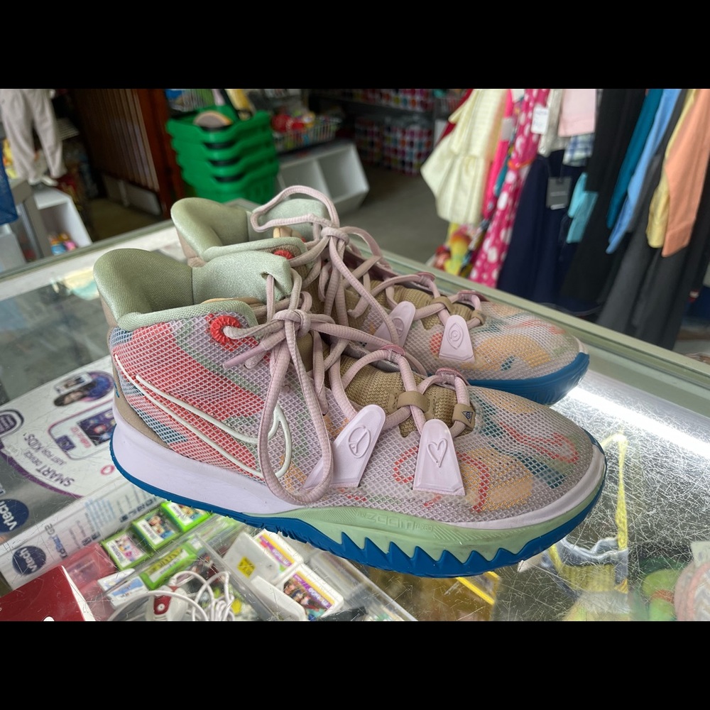 Nike Kyrie Irving 7 GS 1 world 1 people regal pink and tan sneakers